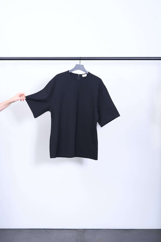 HEAVY JERSEY TOP displayed on a hanger, featuring a relaxed fit and zipper back, perfect for chic outfits.