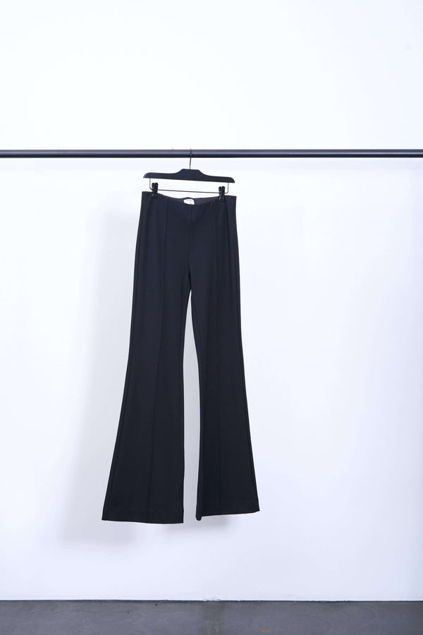 FIONA FLARE TROUSER displayed on a hanger against a white background, showcasing the elegant flared design.