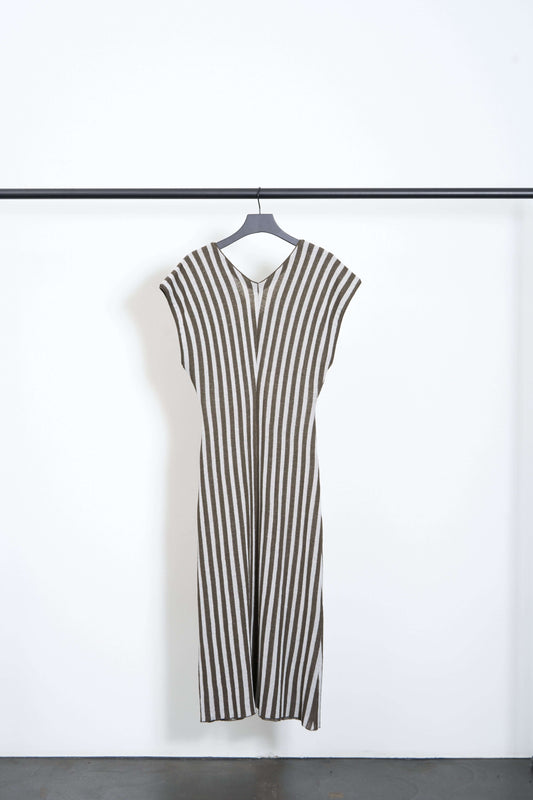 KISEKI DRESS hanging on a rack, showcasing brown and white stripes, fitted waist, and V-neck cutouts.