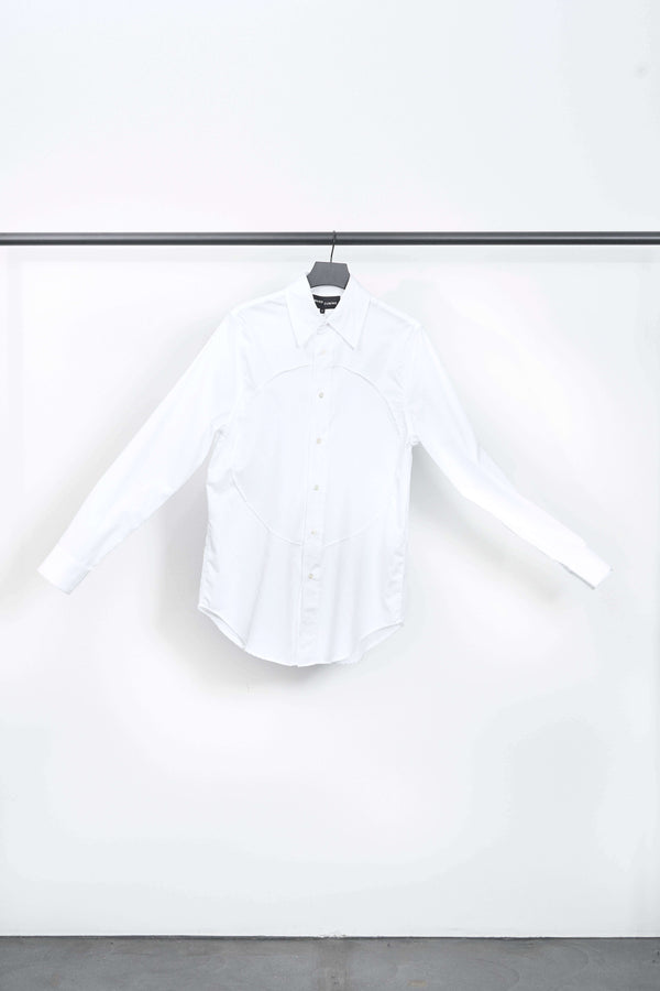 PIN-TUCK LUNG SHIRT displayed on a hanger, showcasing its pristine white cotton fabric and stylish design.