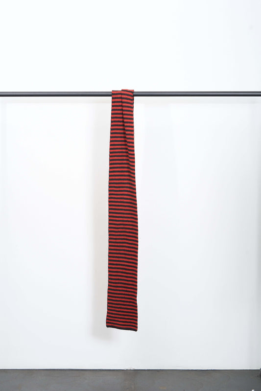 BRUSHED NARROW STRIPE SCARF hanging on a rack, featuring contrasting narrow stripes in soft lambswool.