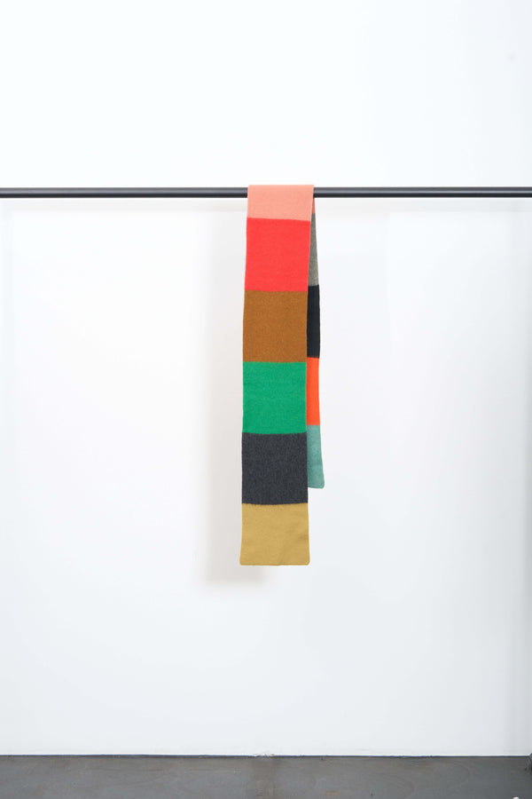 BRUSHED COLOURBLOCK SCARF hanging display showcasing vibrant colored blocks in soft lambswool.