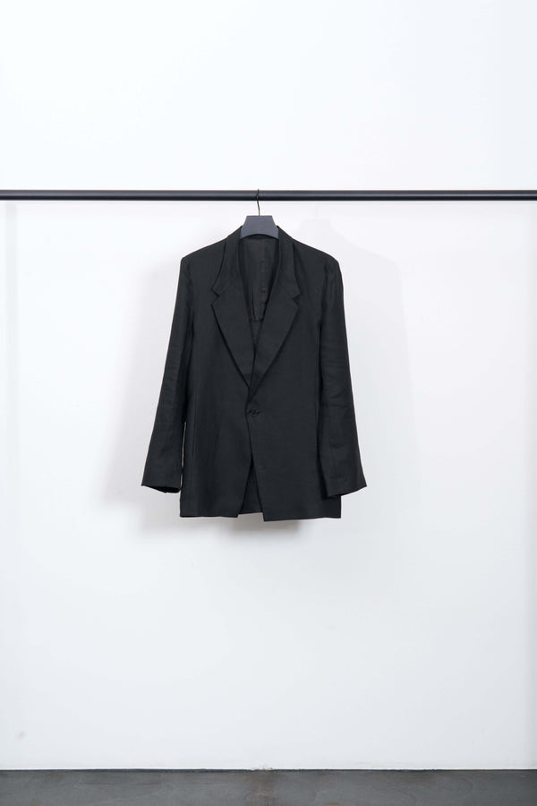 Black LINEN TAILORED JACKET with large lapels and single-button closure, ideal for business and art gallery settings.