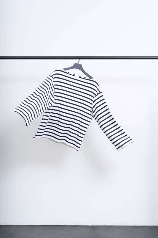 COTTON MARINER TOP hanging on a rack, showcasing its striped design and wide neckline.