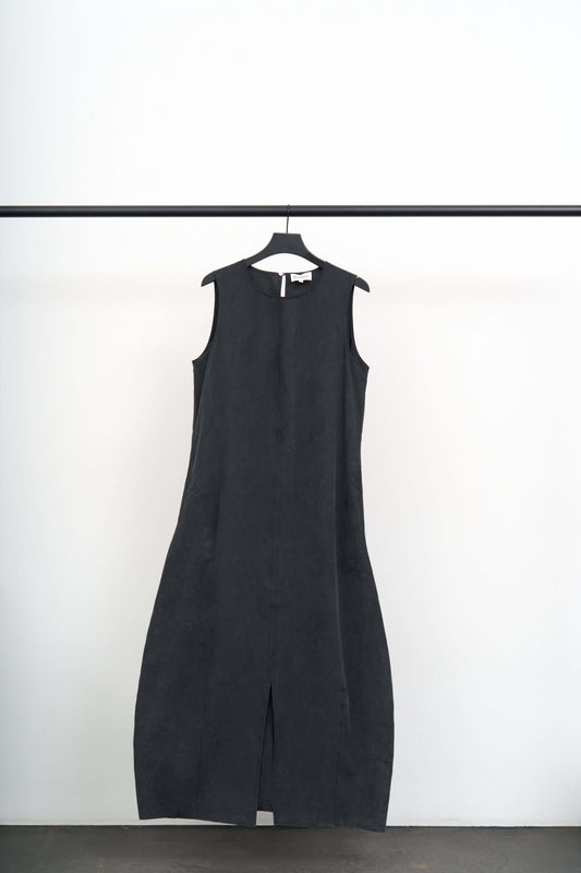 VOLTA -LIGHT TENCEL DRESS hanging on a rack against a white background, showcasing its minimalist design.