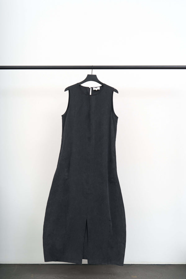 VOLTA -LIGHT TENCEL DRESS hanging on a rack against a white background, showcasing its minimalist design.