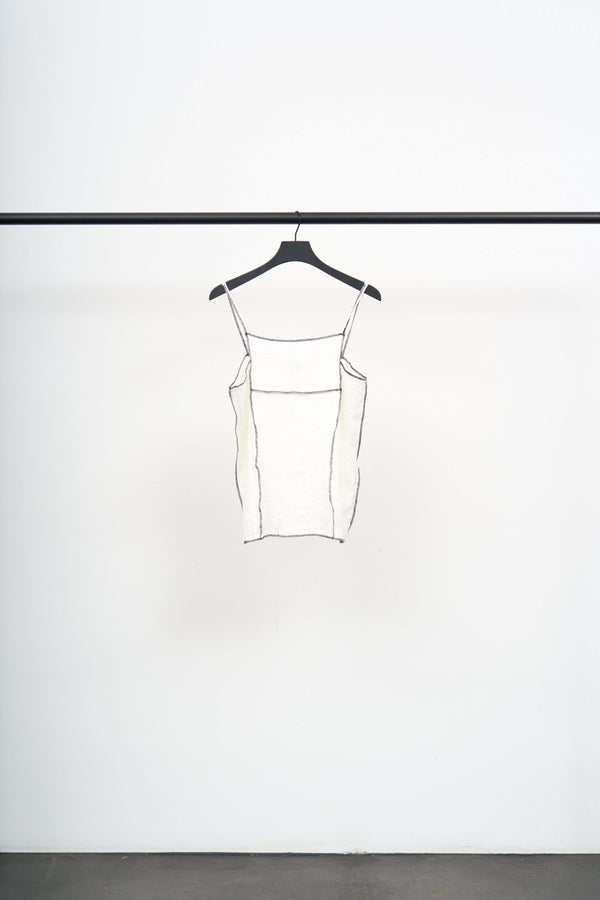 SHOK SQUARE TOP lightweight crinkled linen blend top with black contrast stitching hanging on a black hanger.